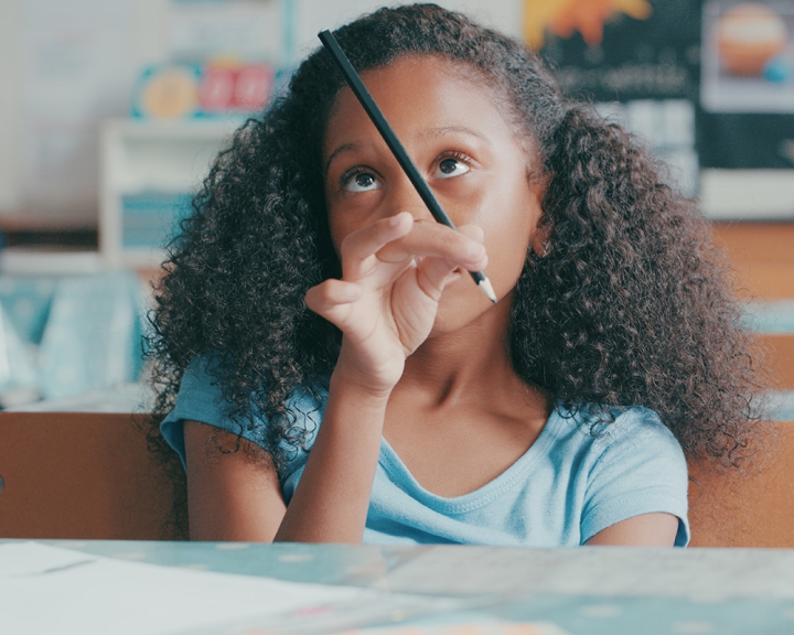 Distracted young girl in classroom