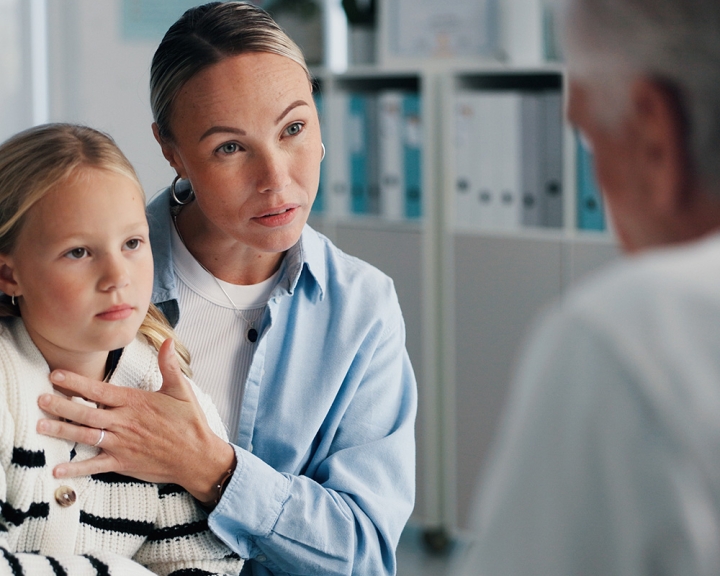 Woman, doctor and girl in clinic for consultation about ADHD